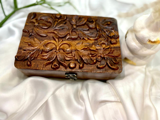 "Handcrafted Wooden Jewelry Box with Intricate Floral Carving"
