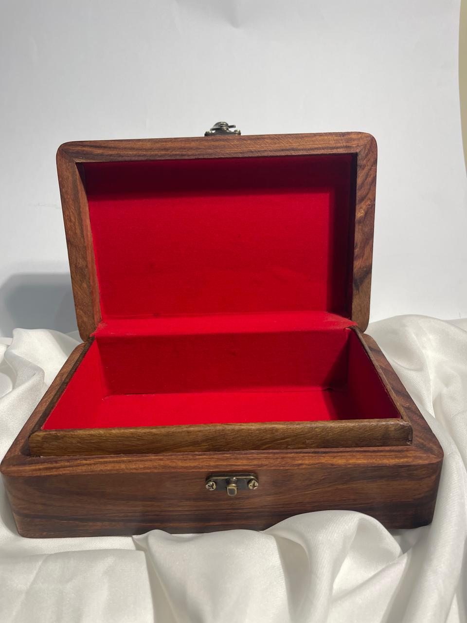 "Handcrafted Wooden Jewelry Box with Intricate Floral Carving"